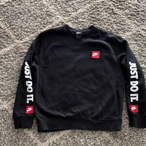 Nike Men's Black Crewneck Sweater with Red Accents